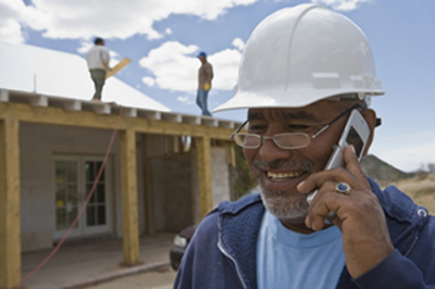 construction and service user on phone